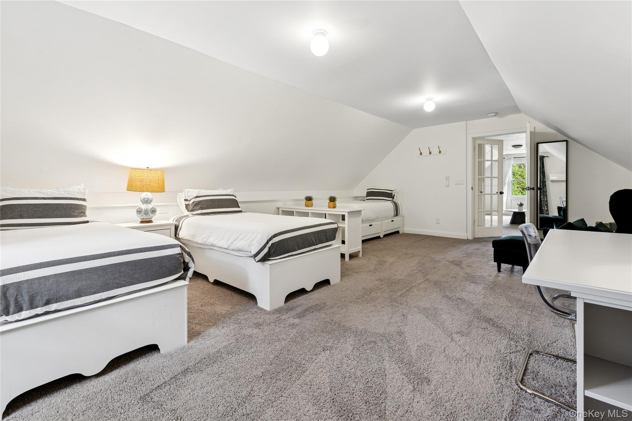 1181 Fireplace Road East Hampton, NY 11937 - Photo 21 of 26 a bed room with a bed and a couch