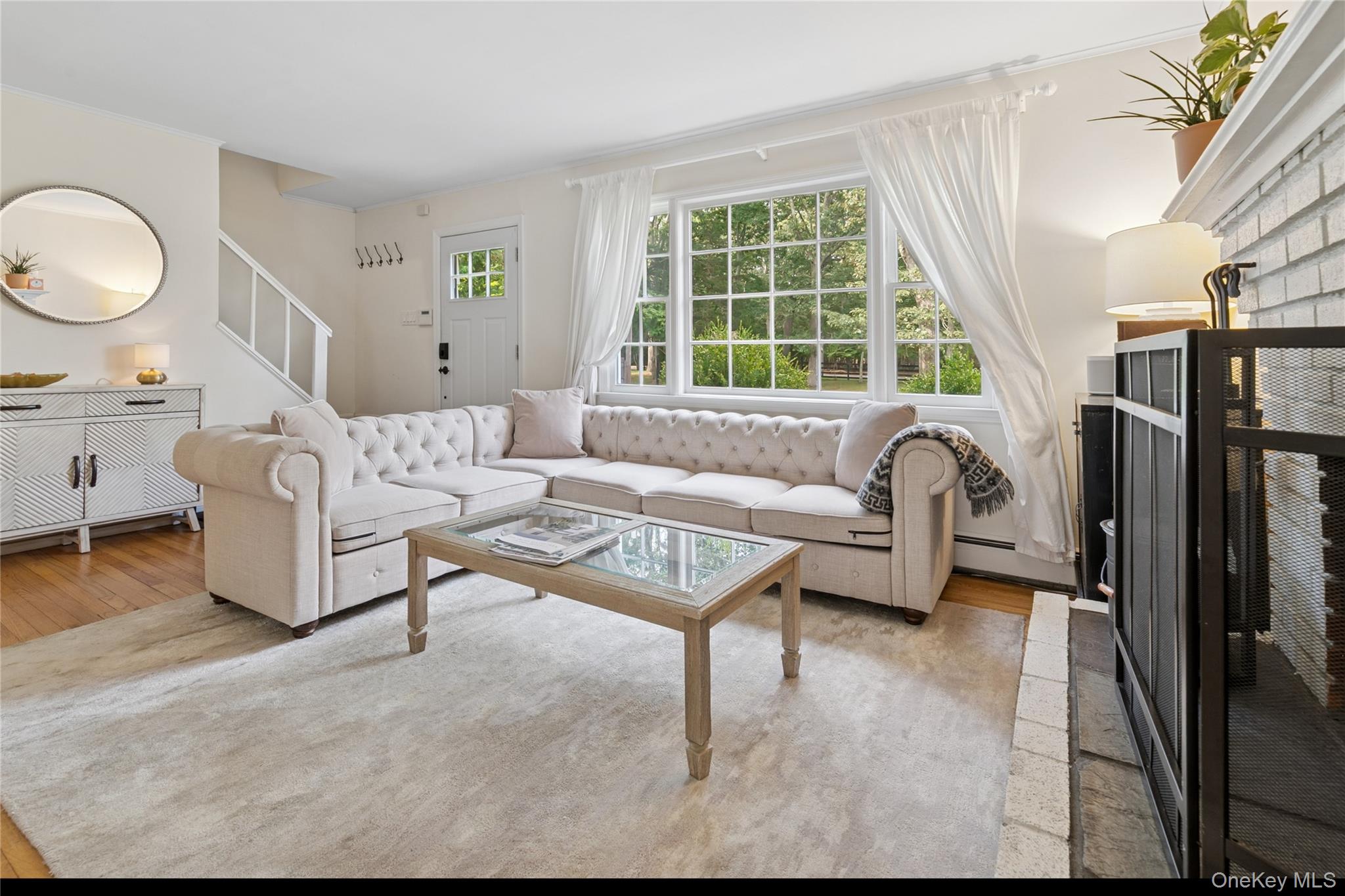 1181 Fireplace Road East Hampton, NY 11937 - Photo 3 of 26 a living room with furniture a large window and a table