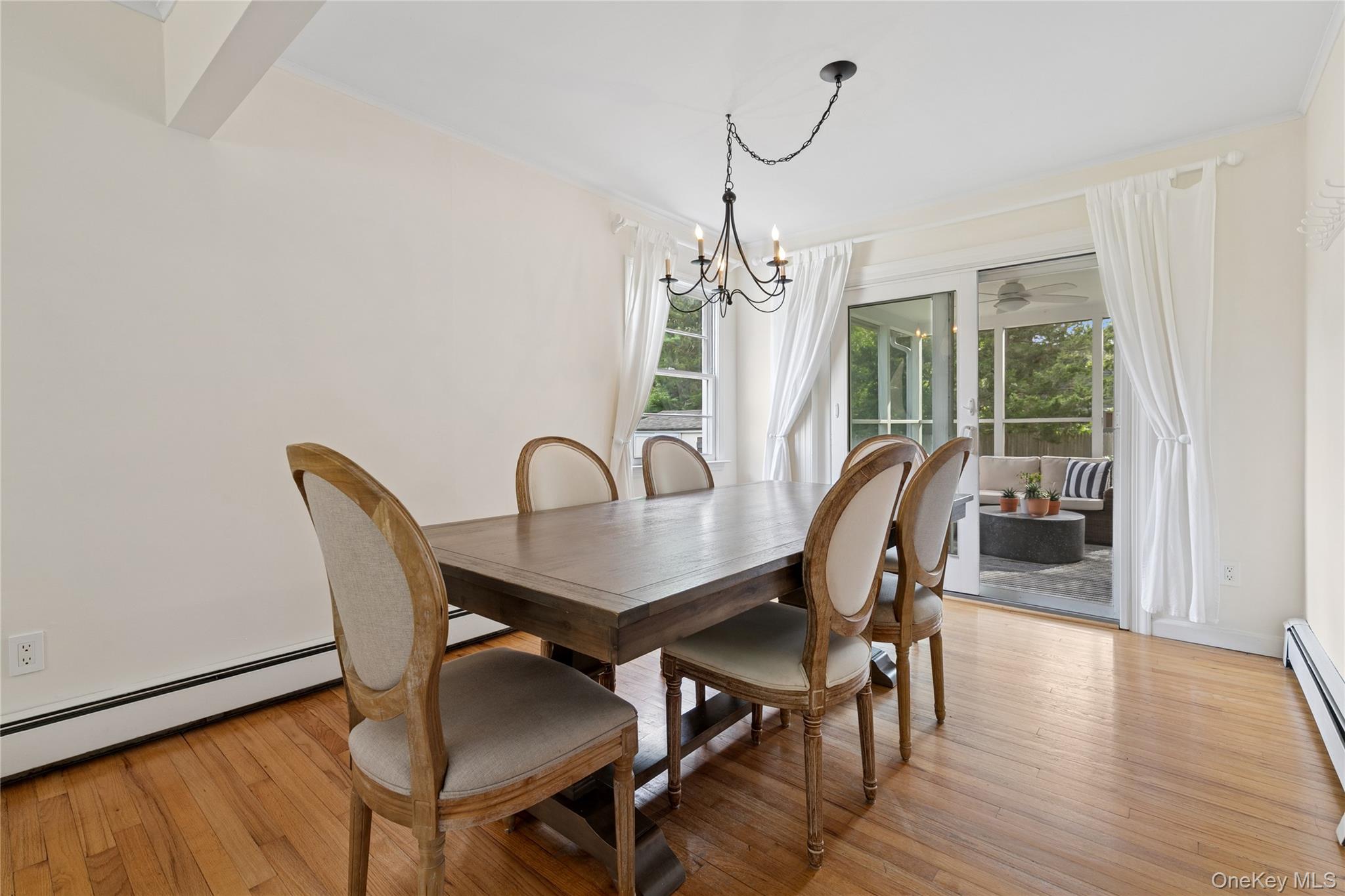 1181 Fireplace Road East Hampton, NY 11937 - Photo 5 of 26 a view of a dining room with furniture window and wooden floor