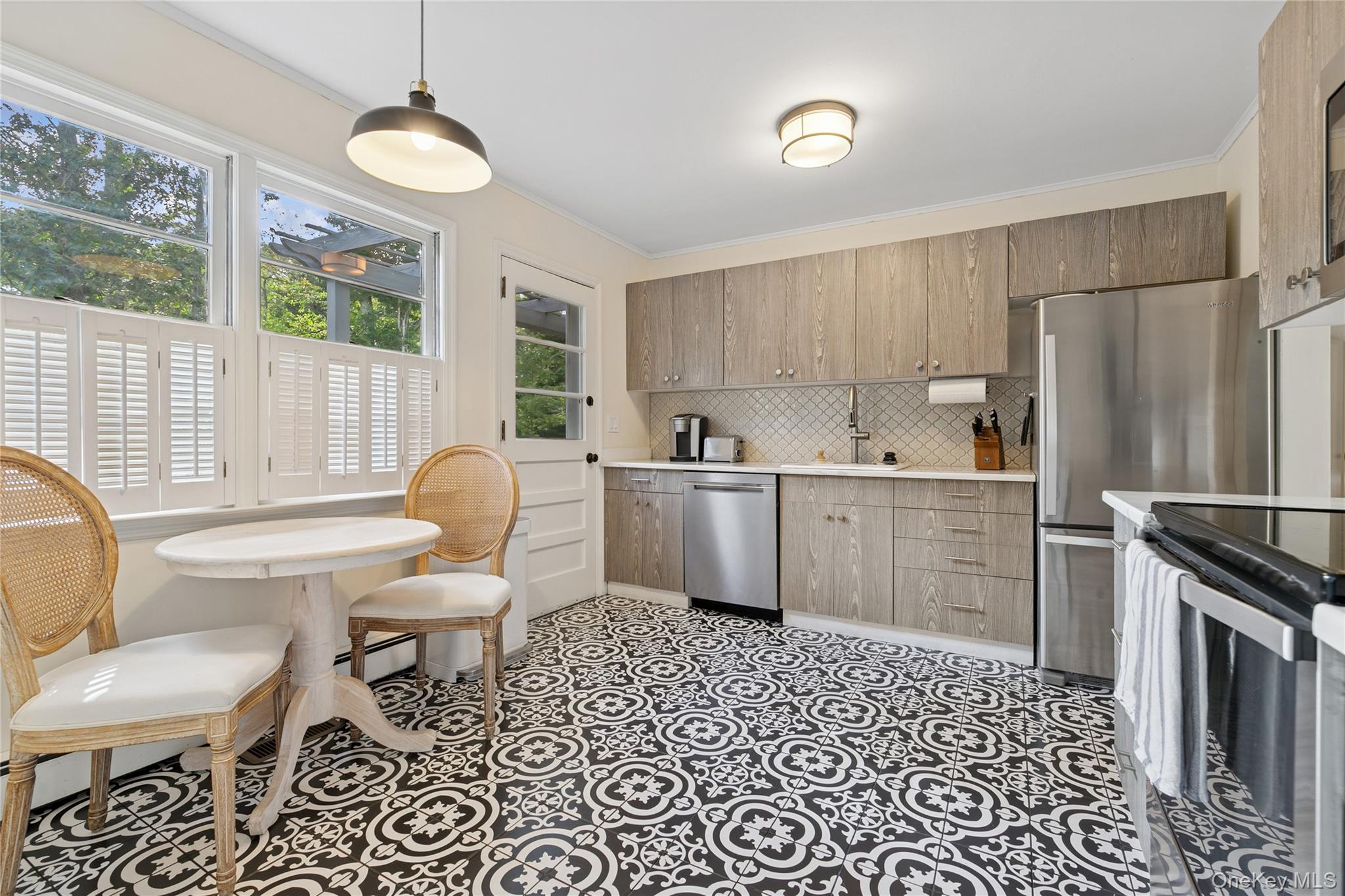 1181 Fireplace Road East Hampton, NY 11937 - Photo 6 of 26 a kitchen with a sink a stove a refrigerator and furniture