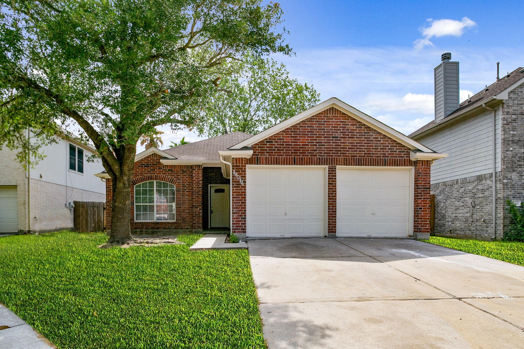 12014 Raven View Drive Houston, TX 77067 - Photo 1 of 29 This charming brick home features a two-car garage and a well-maintained front yard with a mature tree, offering great curb appeal in a cozy neighborhood setting.