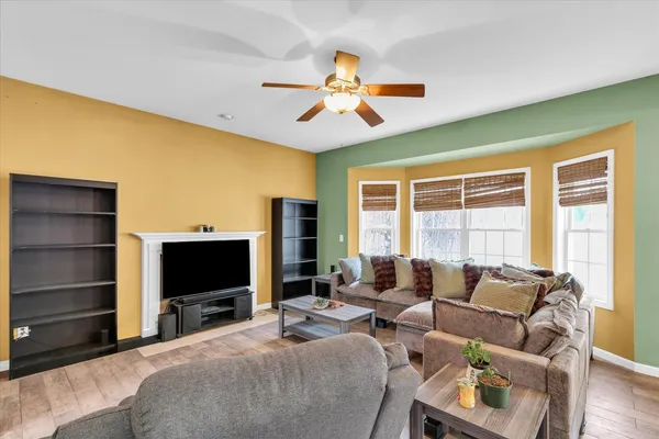 a bedroom with furniture and a flat screen tv