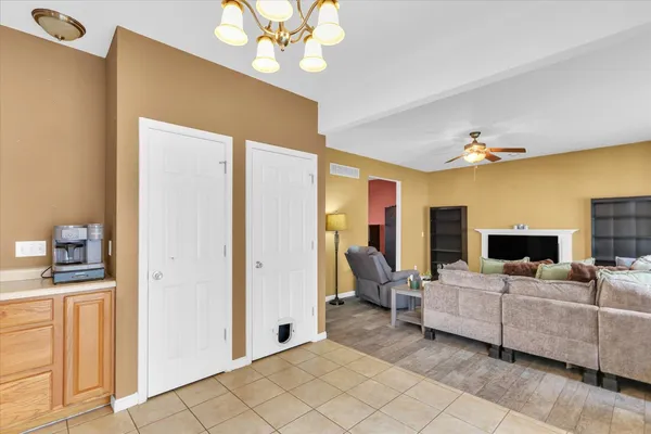 a view of a livingroom with furniture and chandelier