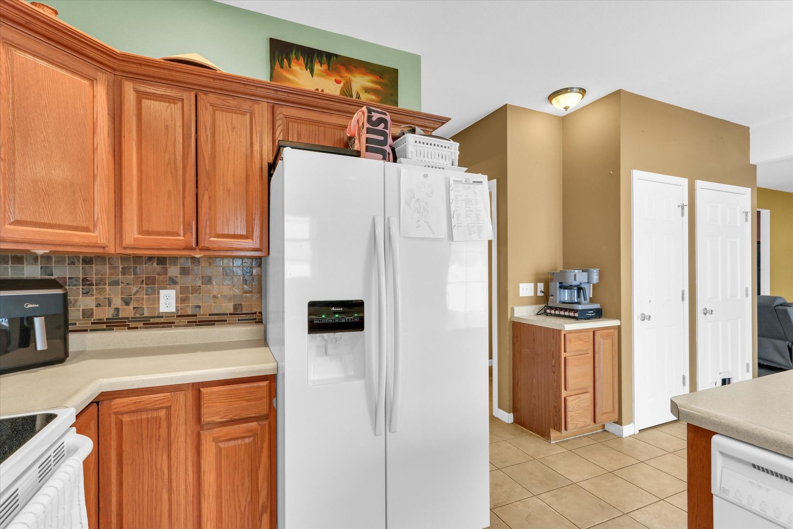 1328 West Ridge Lane Champaign, IL 61822 - Photo 22 of 41 a white refrigerator freezer sitting in a kitchen