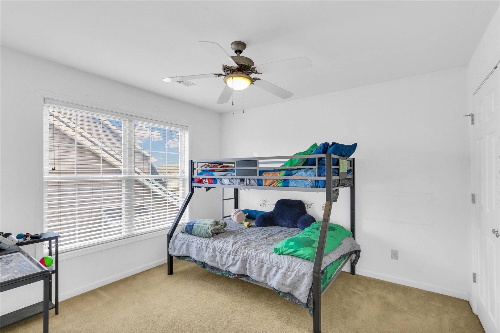 1328 West Ridge Lane Champaign, IL 61822 - Photo 23 of 41 a bedroom with a bed a ceiling fan and a window