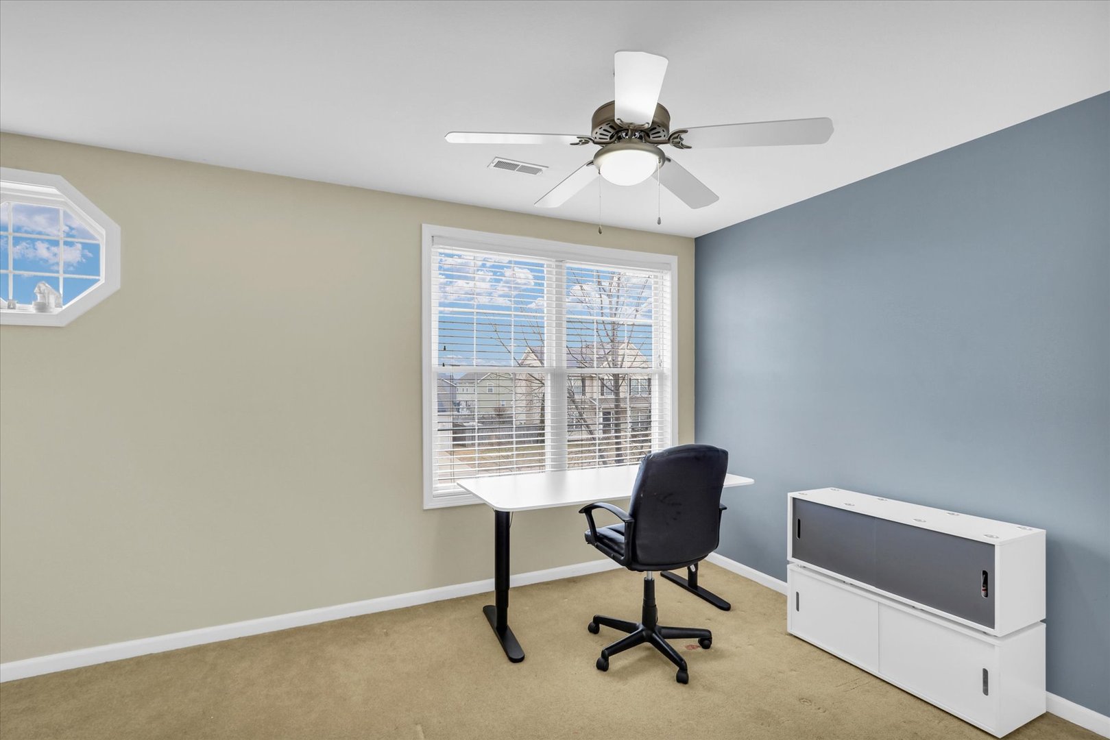 1328 West Ridge Lane Champaign, IL 61822 - Photo 25 of 41 a view of a workspace with furniture and a window