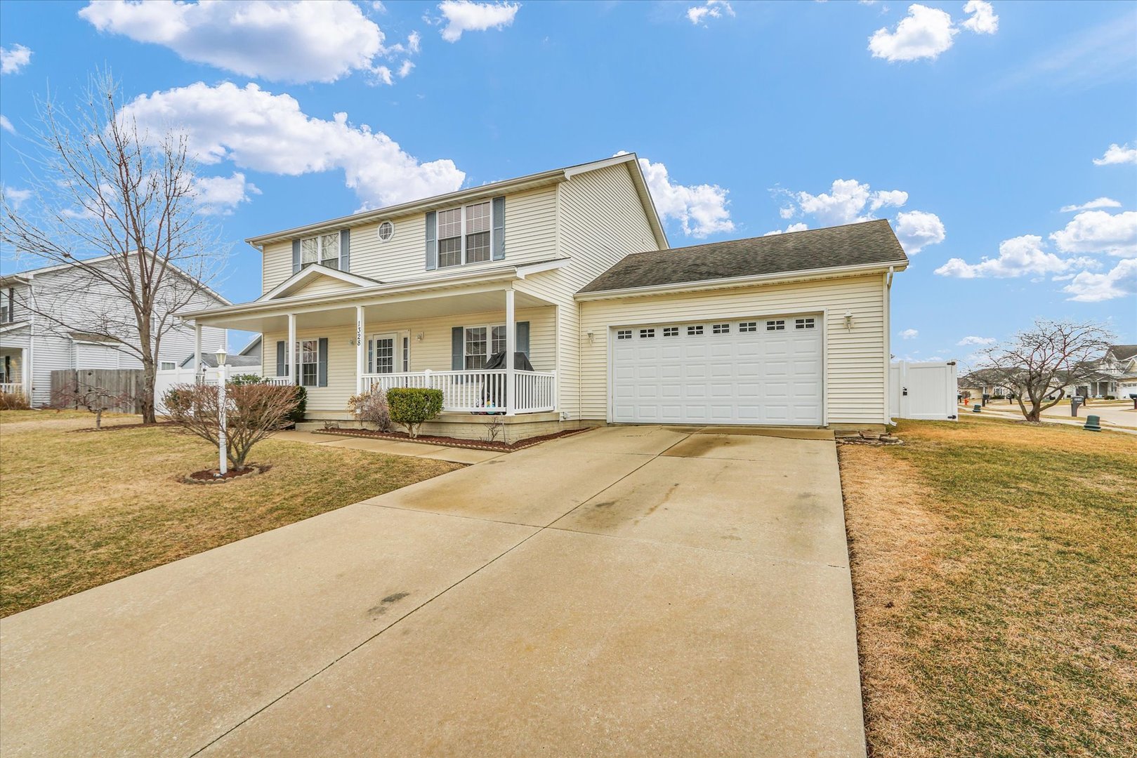 1328 West Ridge Lane Champaign, IL 61822 - Photo 3 of 41 a front view of a building with a yard