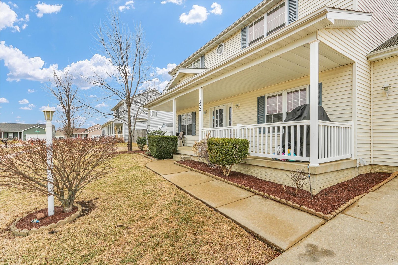 1328 West Ridge Lane Champaign, IL 61822 - Photo 4 of 41 a view of a house with a yard in front of it