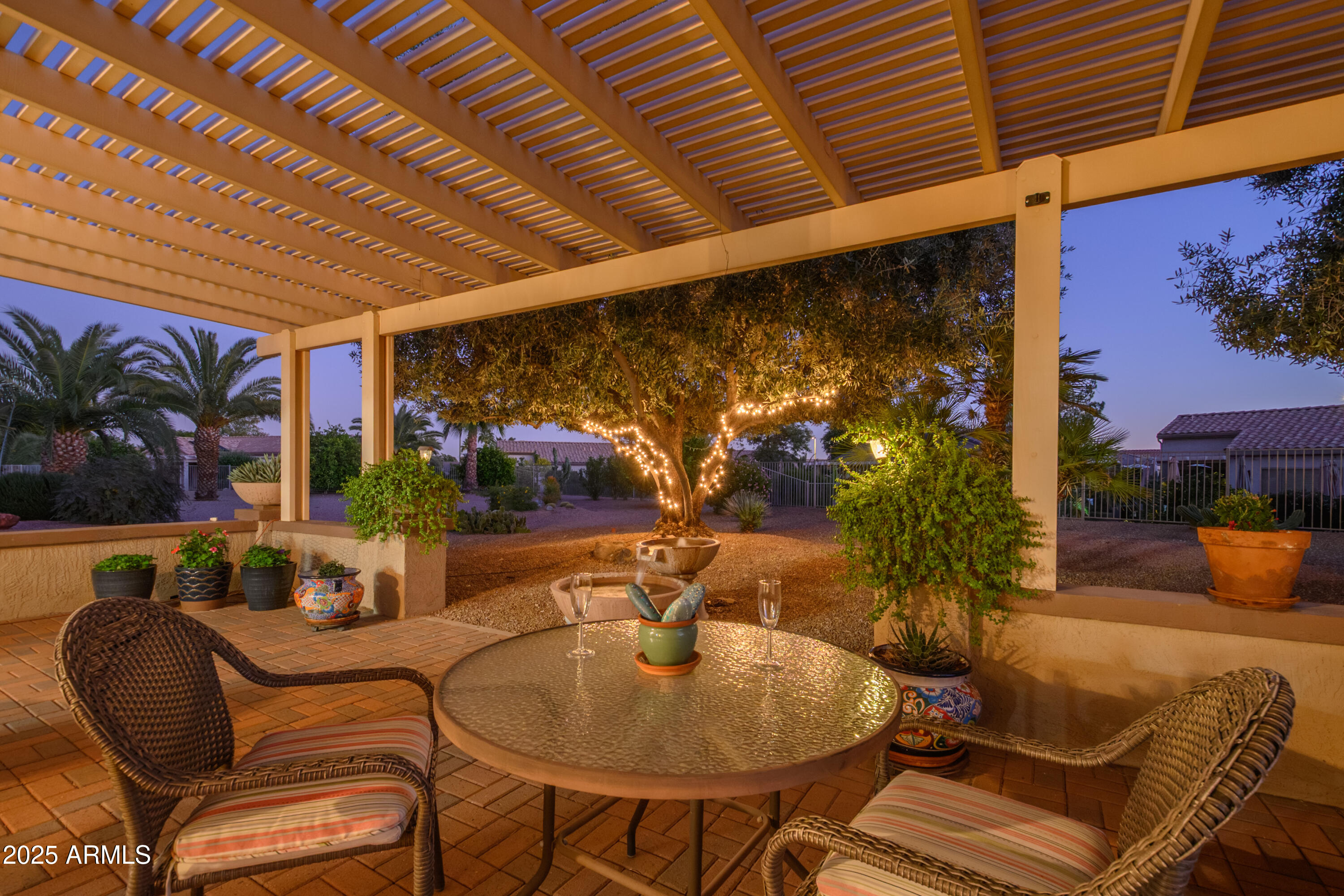15883 West Cisa Rio Lane Surprise, AZ 85374 - Photo 14 of 45 a dining room with furniture and a potted plant