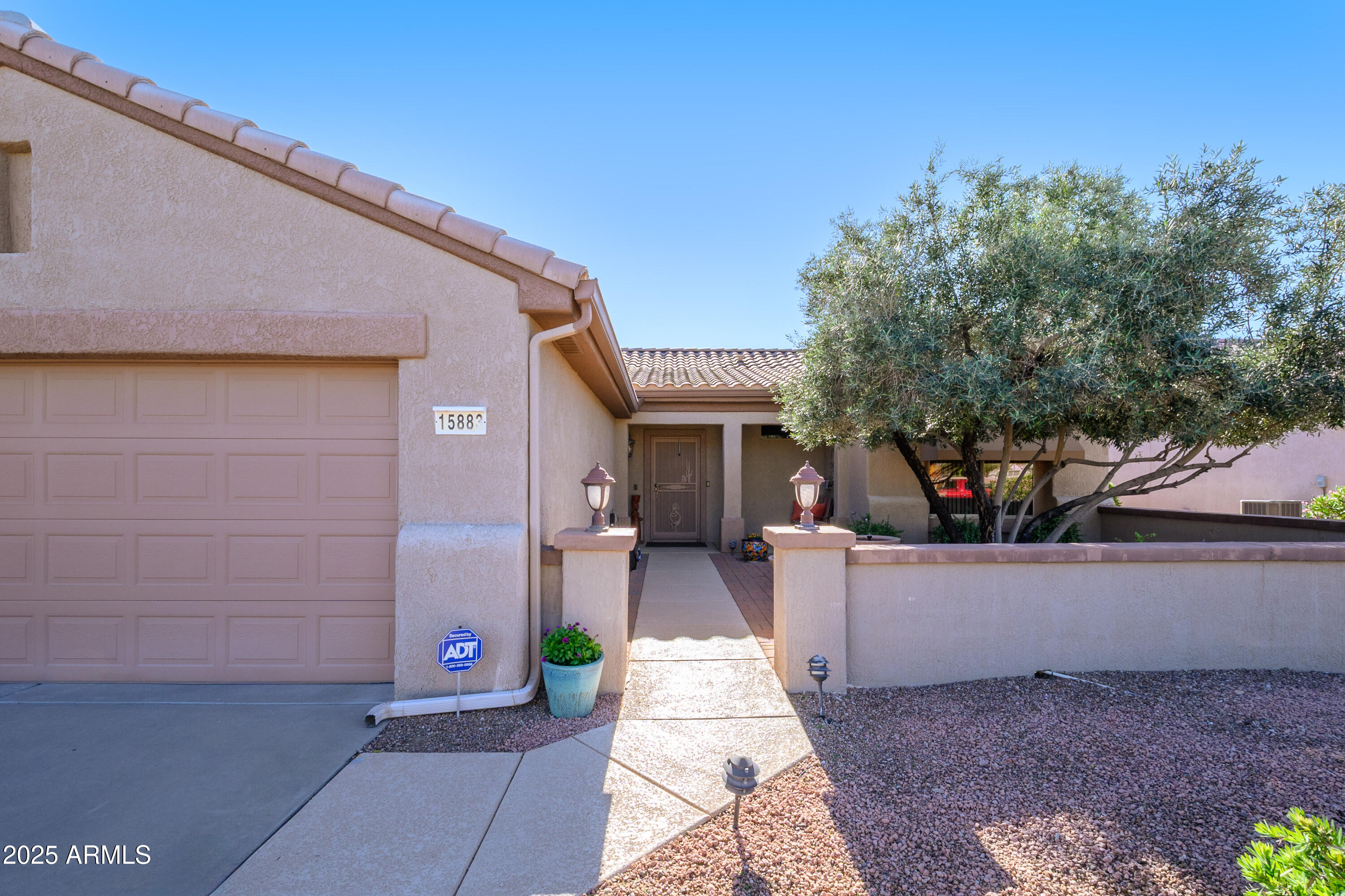 15883 West Cisa Rio Lane Surprise, AZ 85374 - Photo 18 of 45 a front view of a house with patio