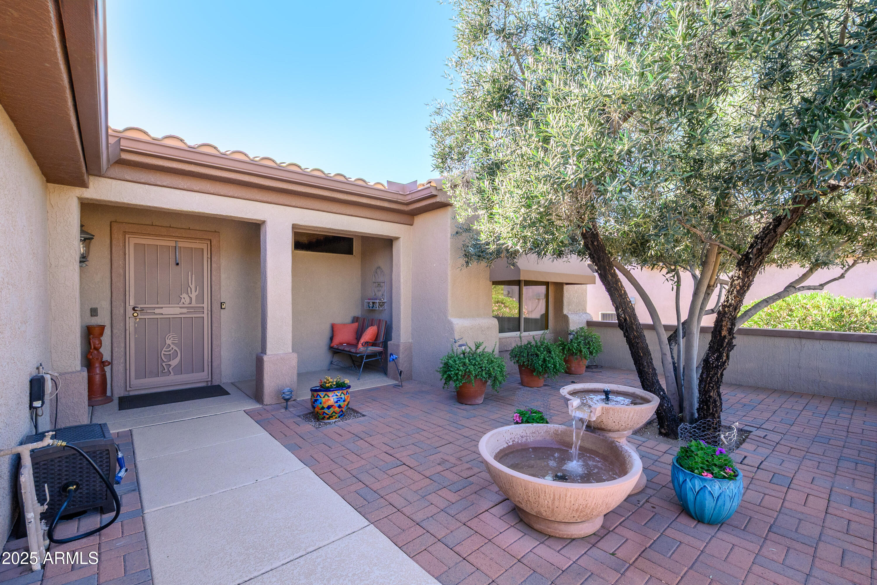 15883 West Cisa Rio Lane Surprise, AZ 85374 - Photo 19 of 45 a lobby with furniture and a potted plant