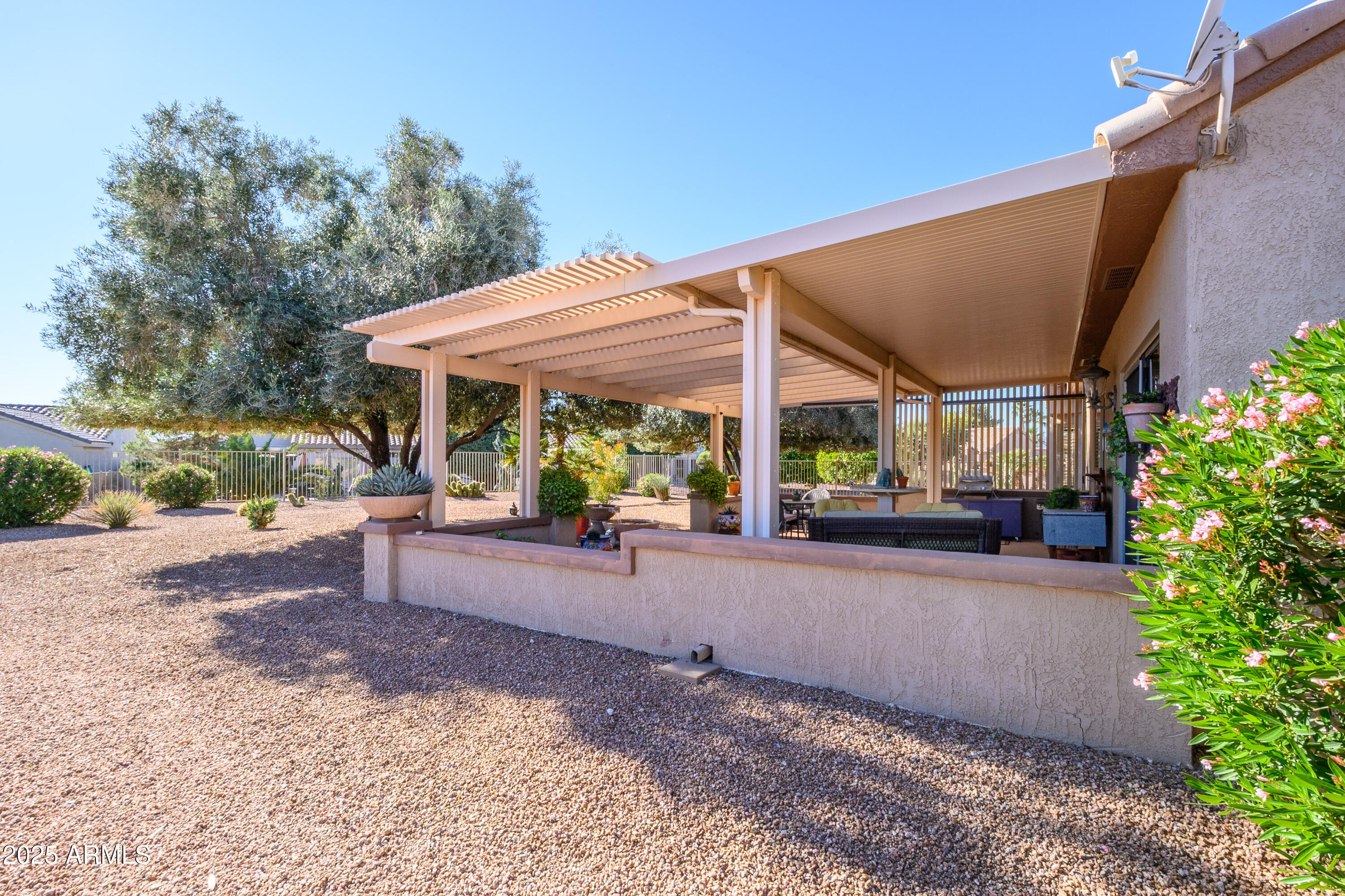 15883 West Cisa Rio Lane Surprise, AZ 85374 - Photo 39 of 45 a view of a house with backyard and sitting area