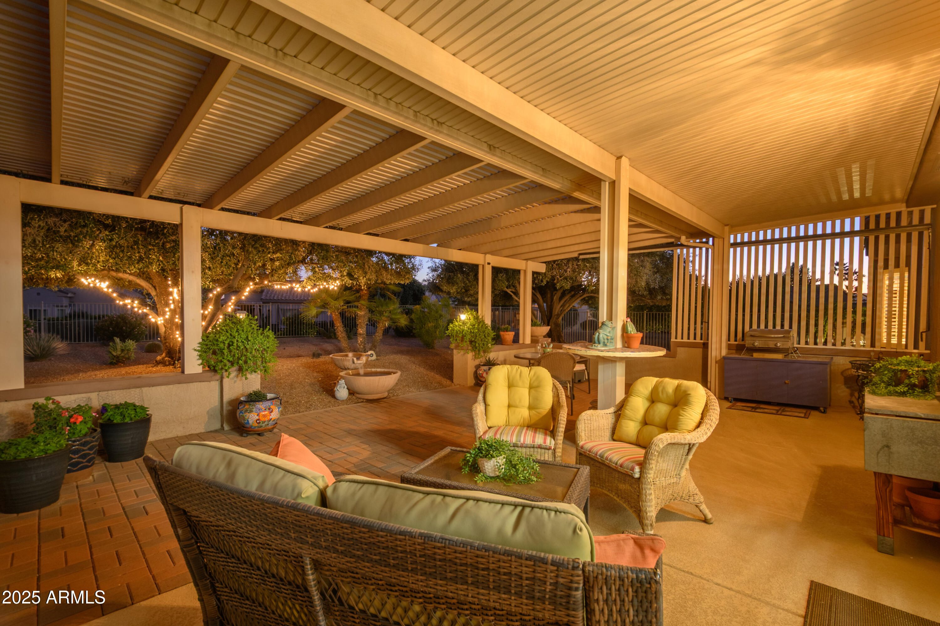 15883 West Cisa Rio Lane Surprise, AZ 85374 - Photo 4 of 45 a building outdoor space with patio furniture and potted plants