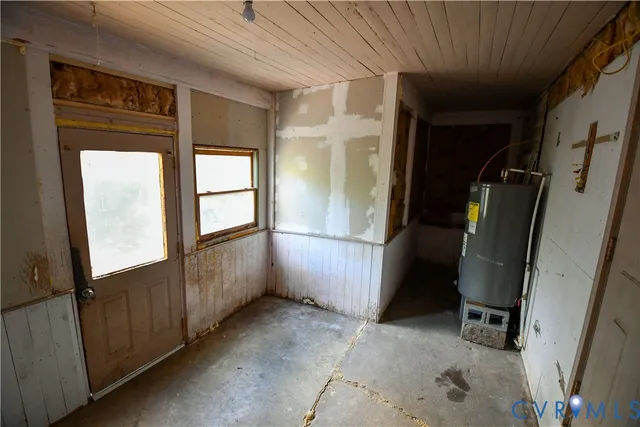 a view of a hallway with wooden floor and entryway