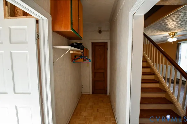 a view of empty room with window and fireplace