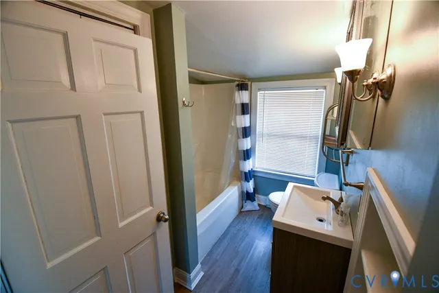 a view of a kitchen from a hallway