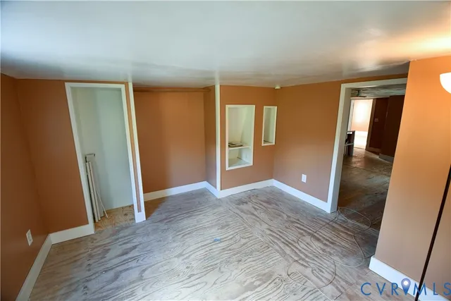 an aerial view of a house with a yard and lake view
