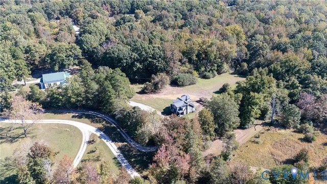 a view of a forest with a building