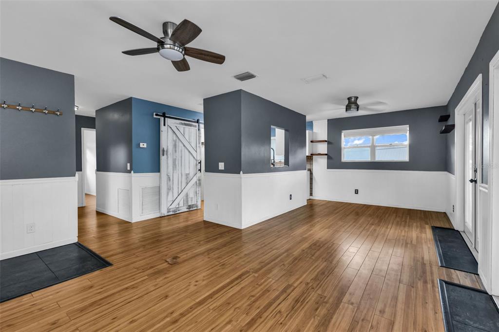 29341 Passion Flower Street Punta Gorda, FL 33982 - Photo 12 of 68 a view of a hallway with wooden floor and cabinet