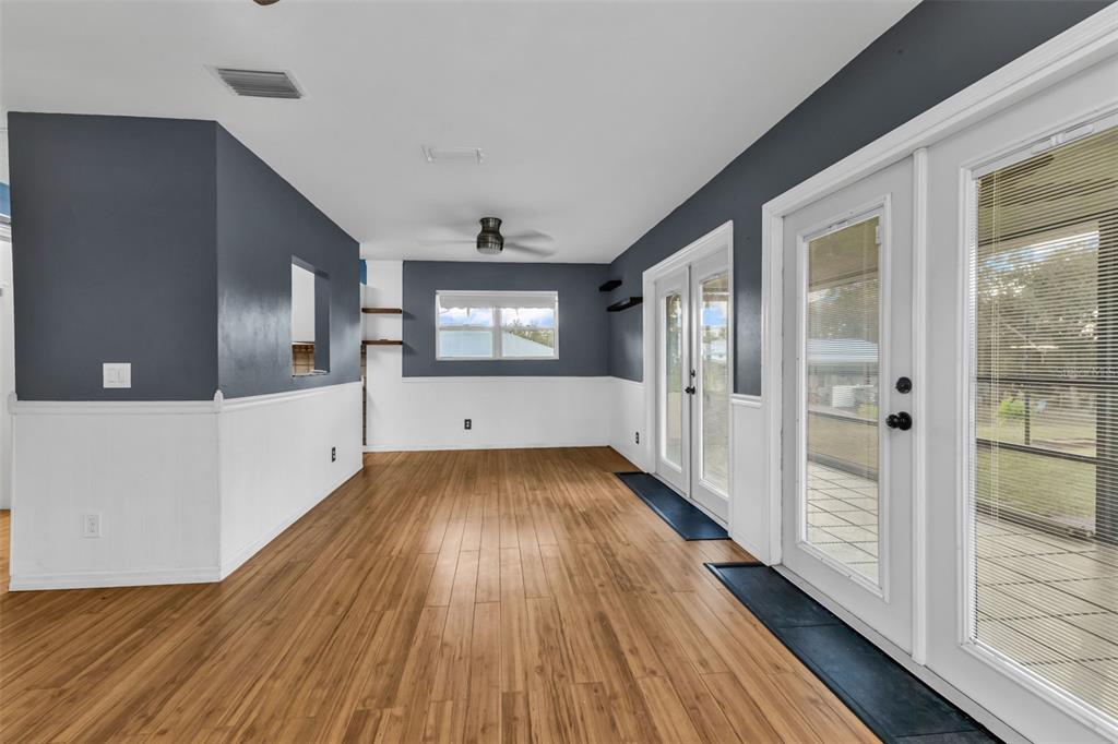 29341 Passion Flower Street Punta Gorda, FL 33982 - Photo 13 of 68 a view of an empty room with wooden floor and a window