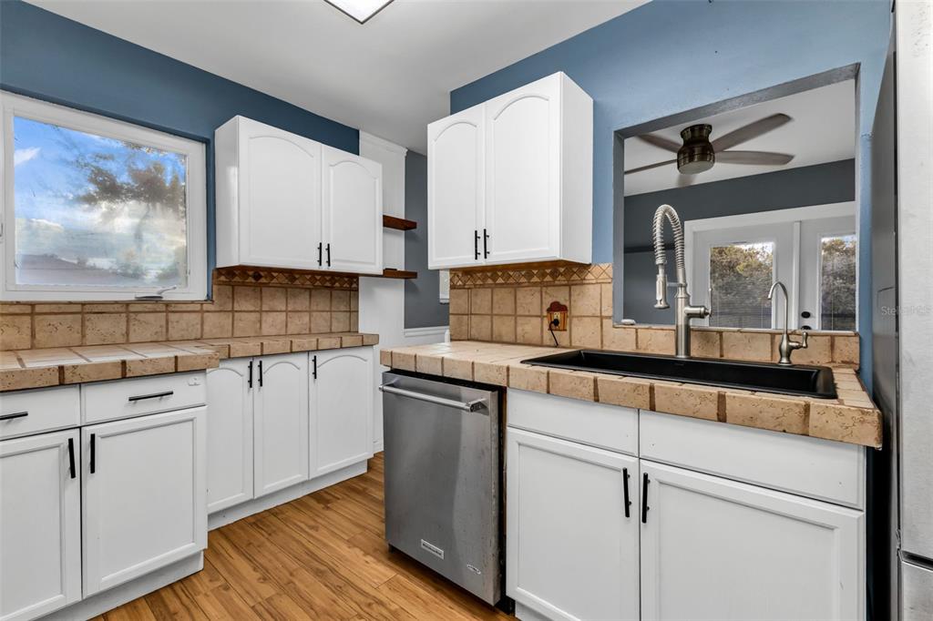 29341 Passion Flower Street Punta Gorda, FL 33982 - Photo 20 of 68 a kitchen with a sink cabinets and window