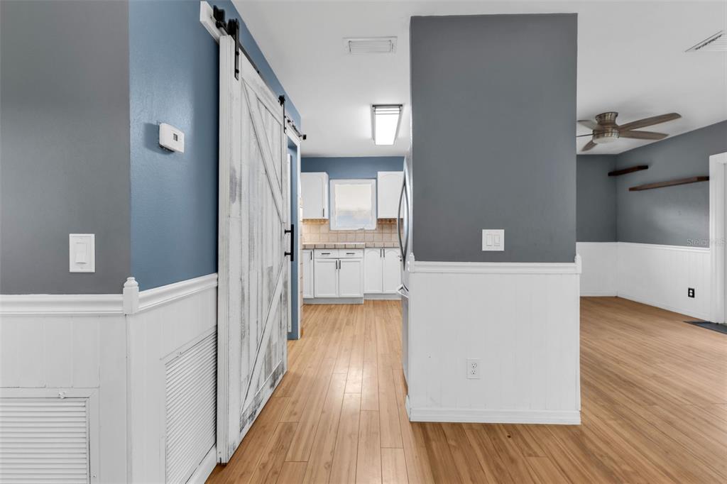 29341 Passion Flower Street Punta Gorda, FL 33982 - Photo 22 of 68 a view of a kitchen cabinets and wooden floor