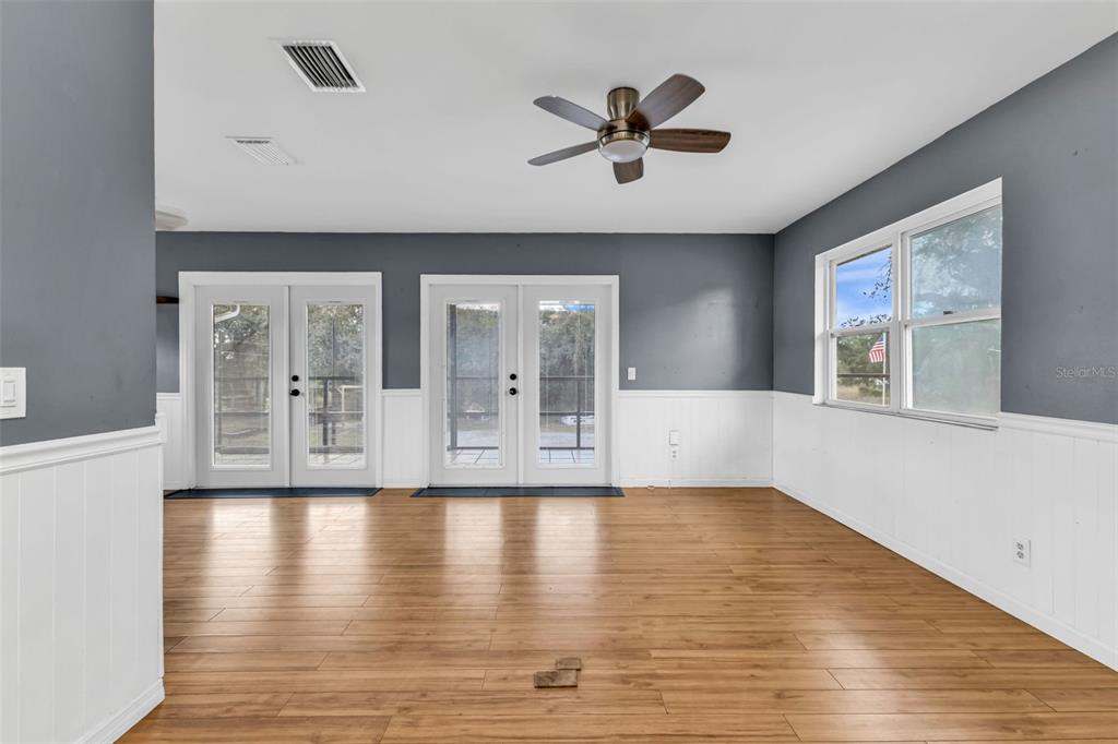 29341 Passion Flower Street Punta Gorda, FL 33982 - Photo 23 of 68 a view of an empty room with wooden floor and a window