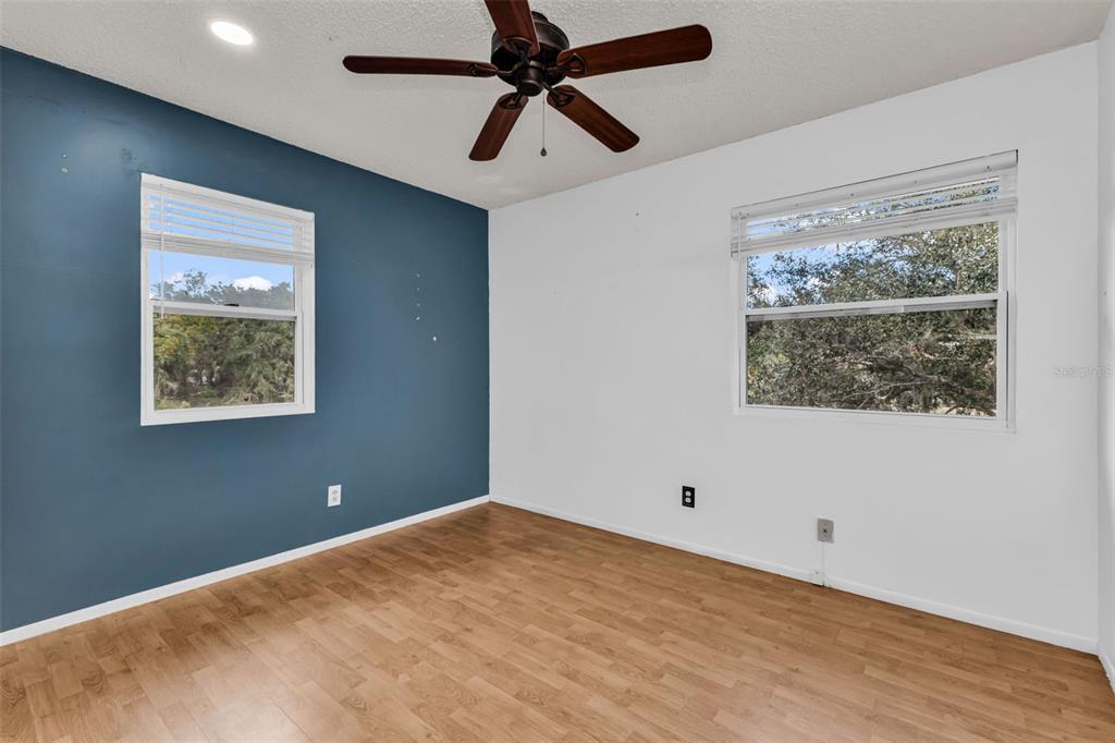 29341 Passion Flower Street Punta Gorda, FL 33982 - Photo 28 of 68 a view of a big room with wooden floor and windows