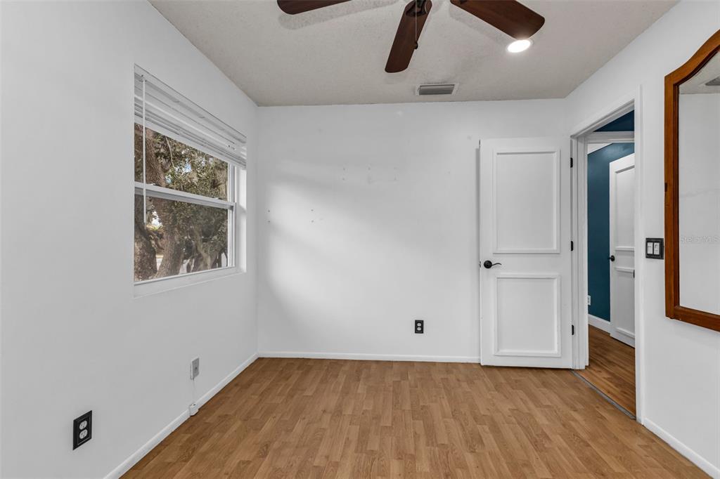 29341 Passion Flower Street Punta Gorda, FL 33982 - Photo 30 of 68 an empty room with wooden floor closet and windows