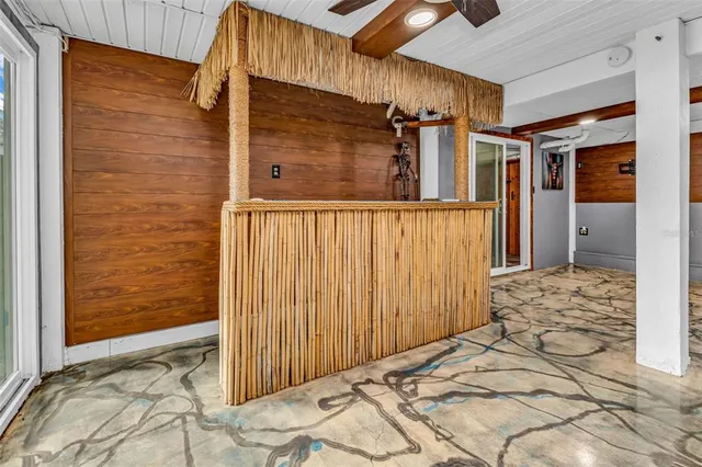 a view of a house with a tree in front of it