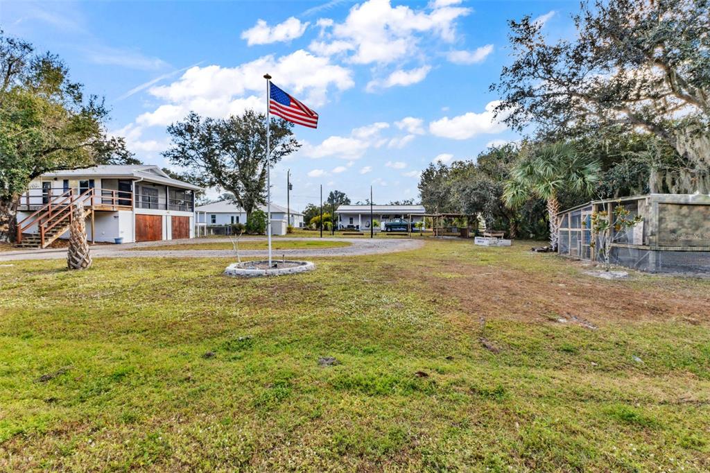 29341 Passion Flower Street Punta Gorda, FL 33982 - Photo 46 of 68 a front view of a house with a yard