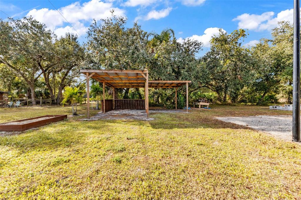 29341 Passion Flower Street Punta Gorda, FL 33982 - Photo 50 of 68 a view of a swimming pool with a patio