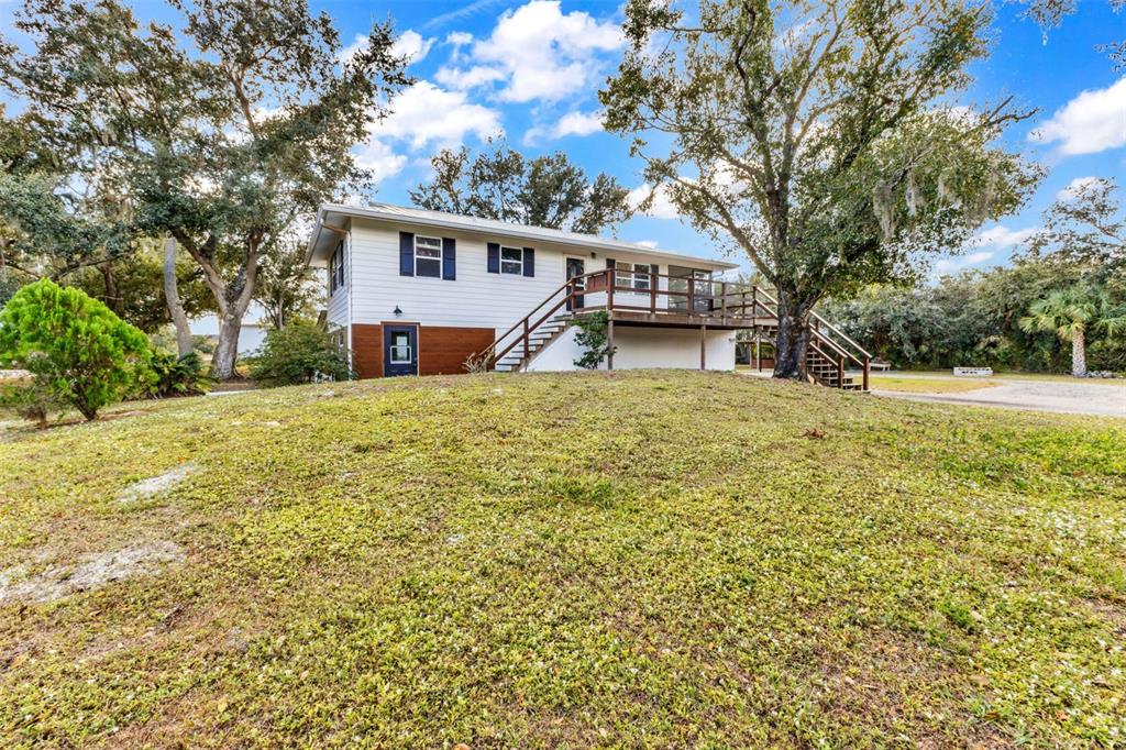 29341 Passion Flower Street Punta Gorda, FL 33982 - Photo 51 of 68 a house that has a tree in front of it