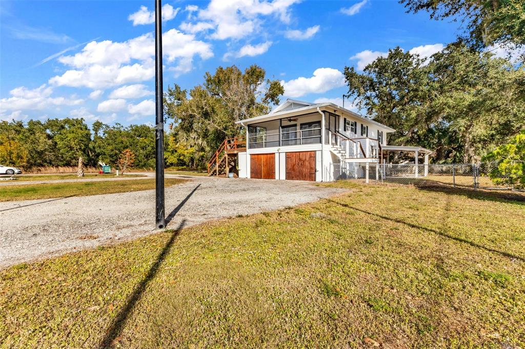 29341 Passion Flower Street Punta Gorda, FL 33982 - Photo 52 of 68 a view of a house with a yard