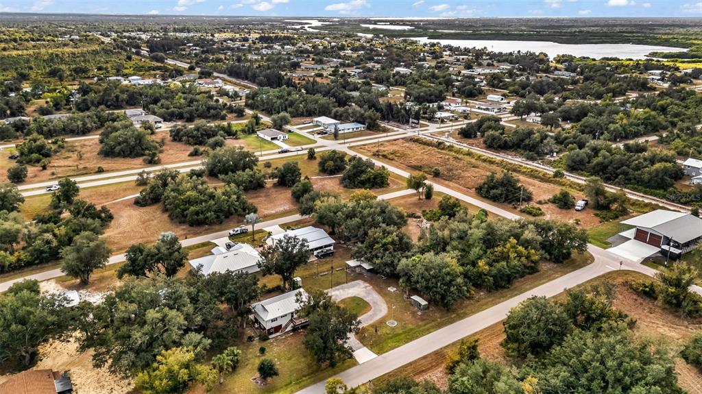 29341 Passion Flower Street Punta Gorda, FL 33982 - Photo 63 of 68 an aerial view of residential houses with outdoor space and trees