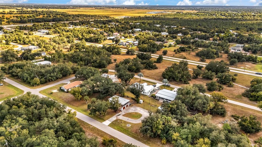 29341 Passion Flower Street Punta Gorda, FL 33982 - Photo 65 of 68 an aerial view of residential houses with outdoor space