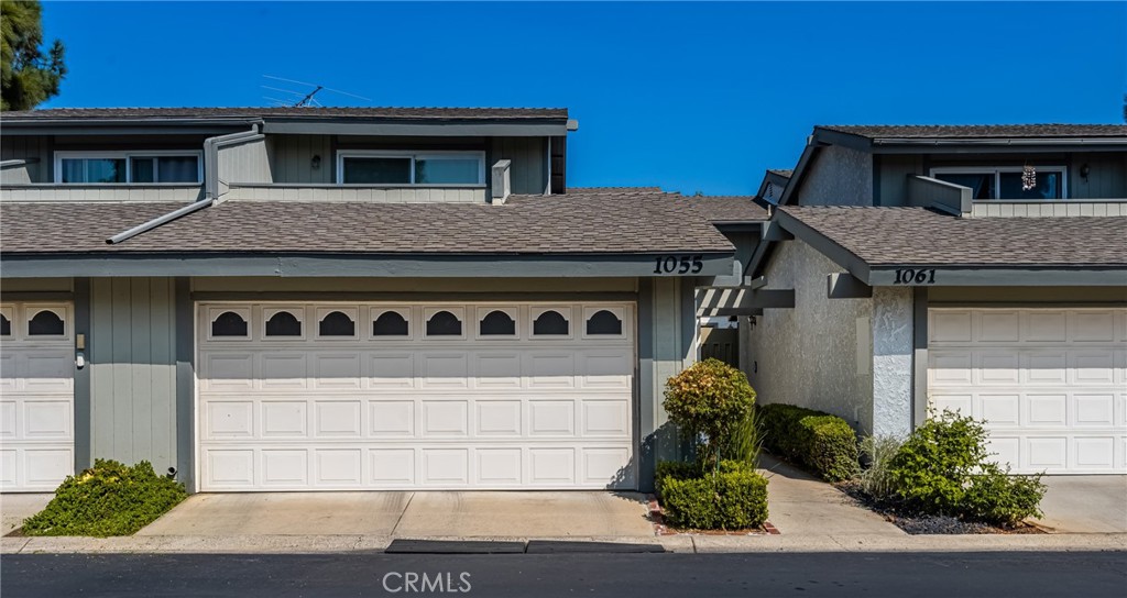 1055 Tustin Pines Way Tustin, CA 92780 - Photo 1 of 31 a front view of a house with garden