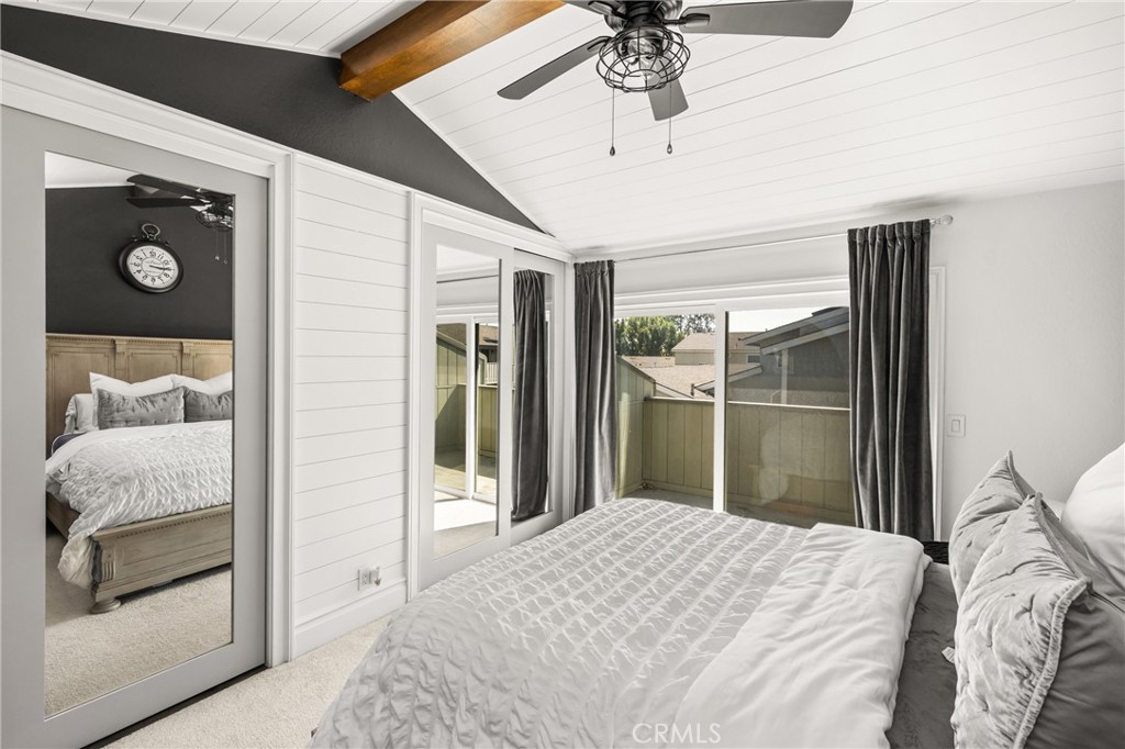 1055 Tustin Pines Way Tustin, CA 92780 - Photo 22 of 31 a bedroom with a bed and a chandelier