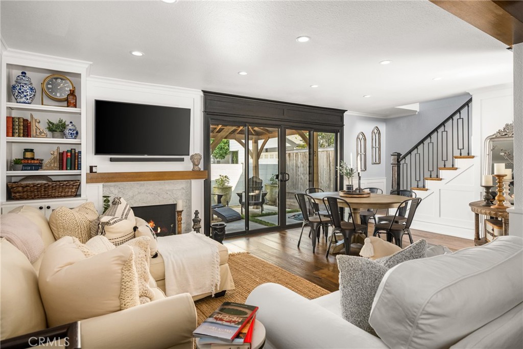 1055 Tustin Pines Way Tustin, CA 92780 - Photo 8 of 31 a living room with furniture and a flat screen tv