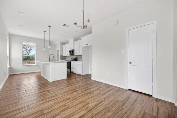 a view of kitchen with wooden floor