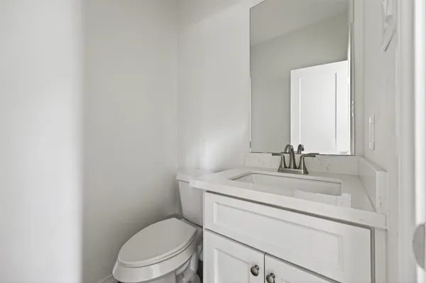 a view of a small space with wooden floor and a window