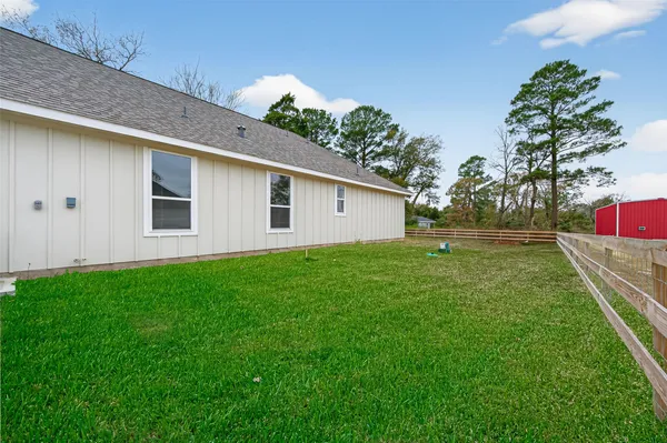 a view of a house with a yard porch and sitting area