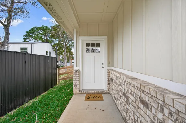 a view of a pathway of a house with a garden