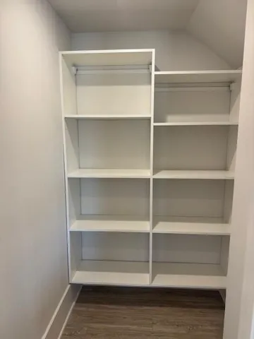 a view of an empty walk in closet