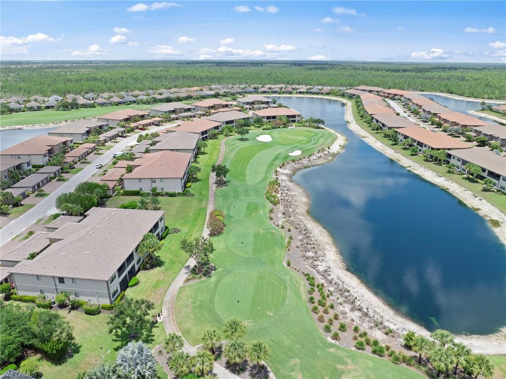 9366 Pocida Court, Unit 202 Naples, FL 34119 - Photo 29 of 44 an aerial view of a golf course with a garden