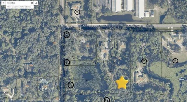 a bathroom with a granite countertop shower a sink and a mirror