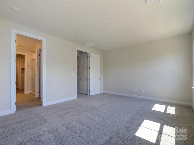 a spacious bathroom with a double vanity sink mirror and shower