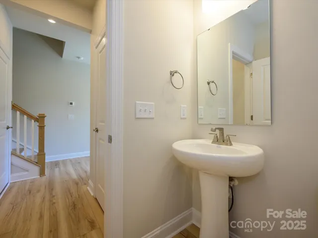 a bathroom with a sink a mirror and shower
