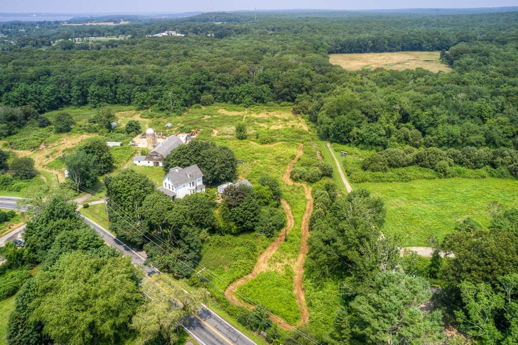 228 E Road Tiverton, RI 02878 - Photo 5 of 27 a view of a lake with a city