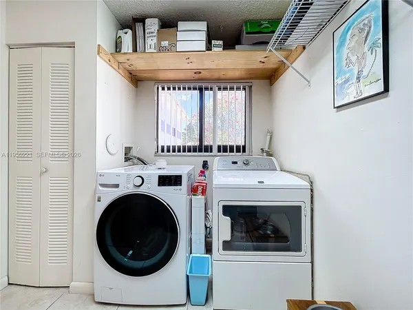 a utility room with dryer and washer